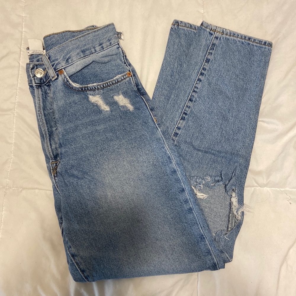 Distressed blue jeans